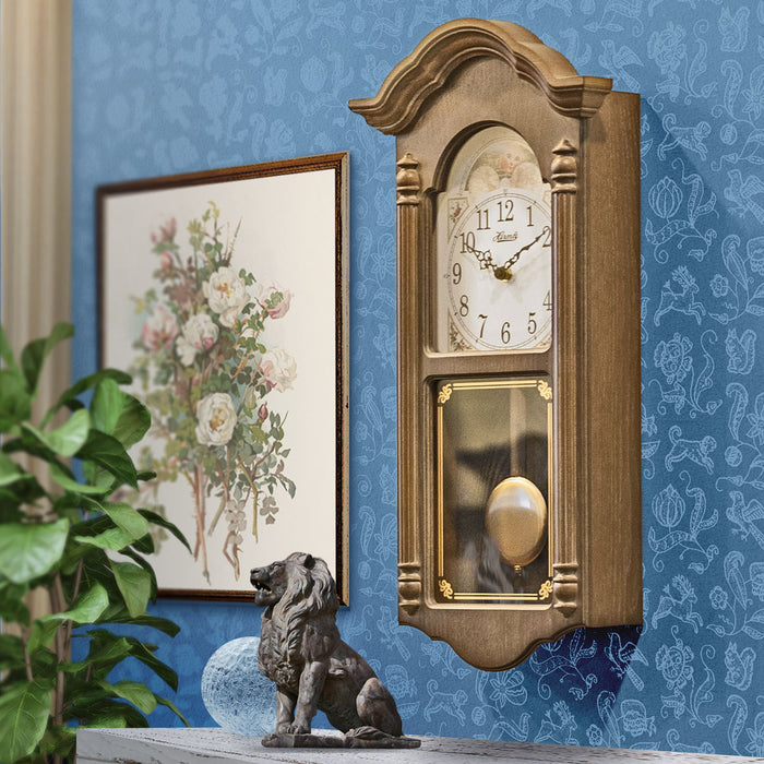 Wooden vintage style wall clock in farmhouse living room.