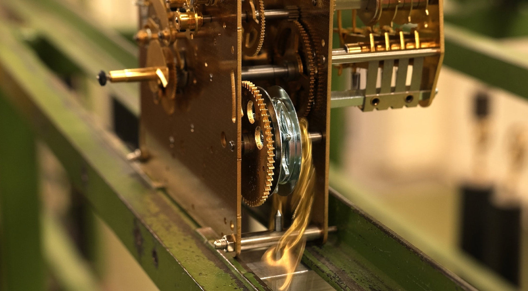 Close-up of mechanical clock movement chain and gears