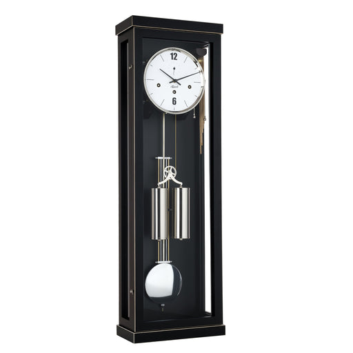 Black wall clock with dual weights and pendulum on a white background