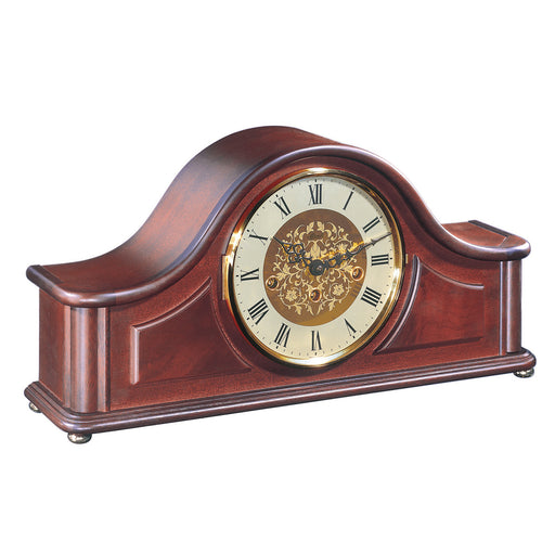 Wooden mantel clock with brass highlights and roman numeral face