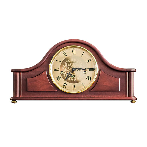 Wooden tambour style mantel clock with roman numerals, on a white background