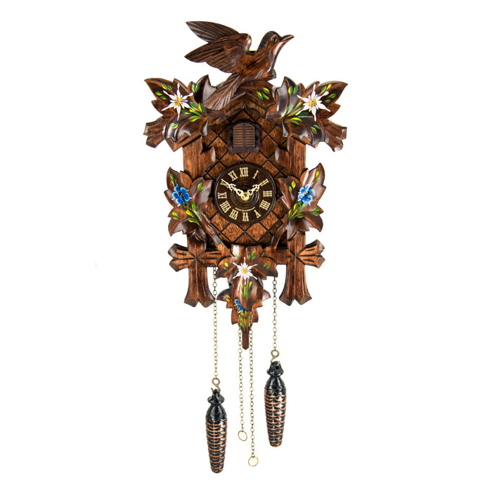 Wooden cuckoo clock with detailed design featuring flowers and birds on a white background