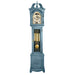 Blue finish wood Grandmother clock with brass highlights on white background