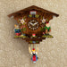 Wooden vintage style cuckoo clock with gnomes and girl on swing 