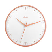 Wall clock with rose gold highlights and white face with Hermle logo on white background.
