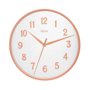 Wall clock with white face and gold numbers on white background.