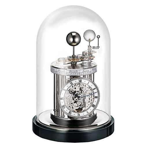Decorative black and nickel Astrolabium clock with mechanical components under a glass dome on a white background
