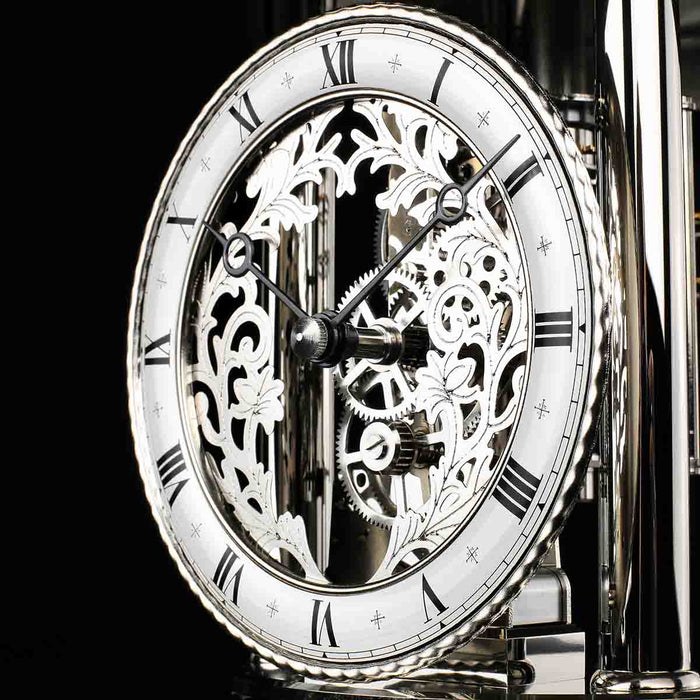 Skeleton clock face with finely crafted gears visible behind the hands