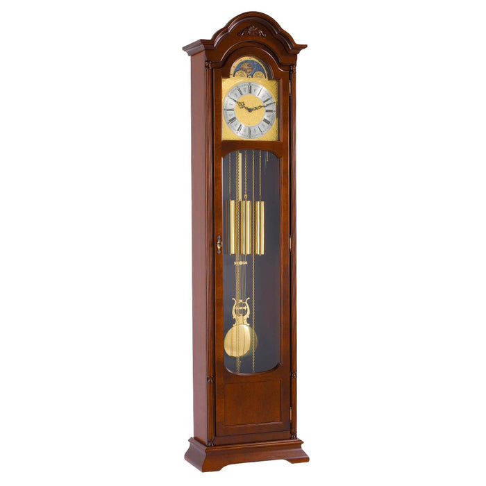 Walnut Grandfather clock with brass face and weights on white background
