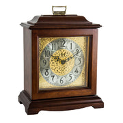 Cherry wood decorative clock with intricate design on a white background
