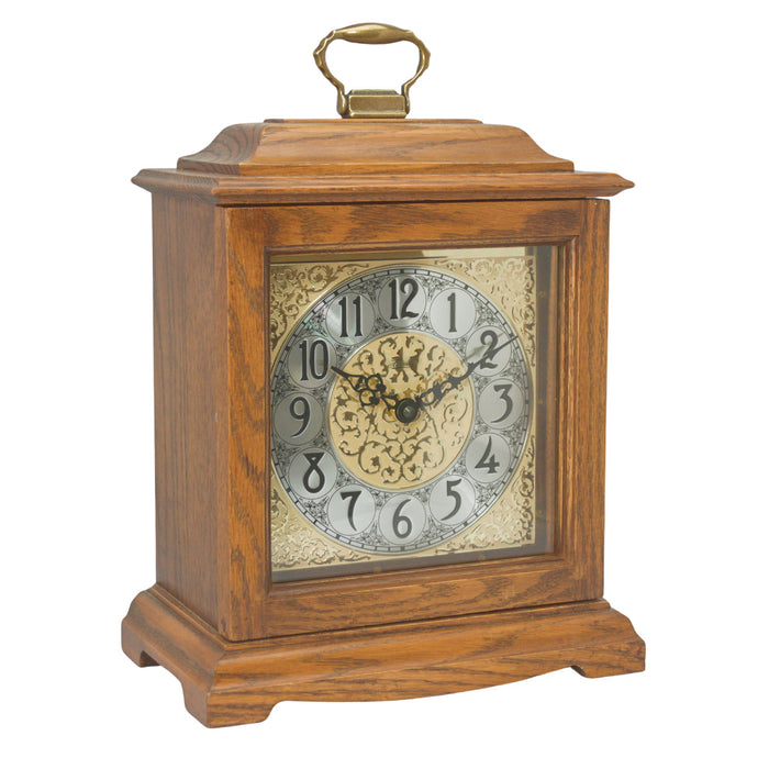 Dark Oak wood decorative clock with intricate design on a white background