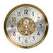 Brass and nickel clock face with ornate designs on white background.