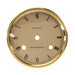 Brass rimmed dial with cream face and Roman Numerals on white background. 