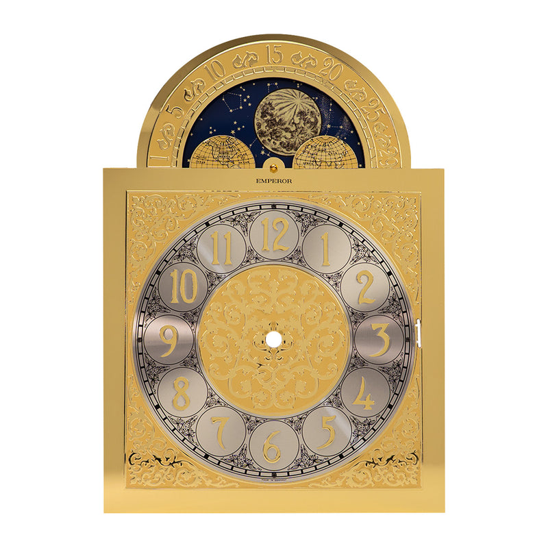 Brass clock face with moon dial and ornate design on white background.