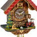 Close-up of German cuckoo clock with red tractor and young deer.