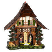 Dark wood cuckoo-style weather station with carved pine trees and deer figurines on white background.