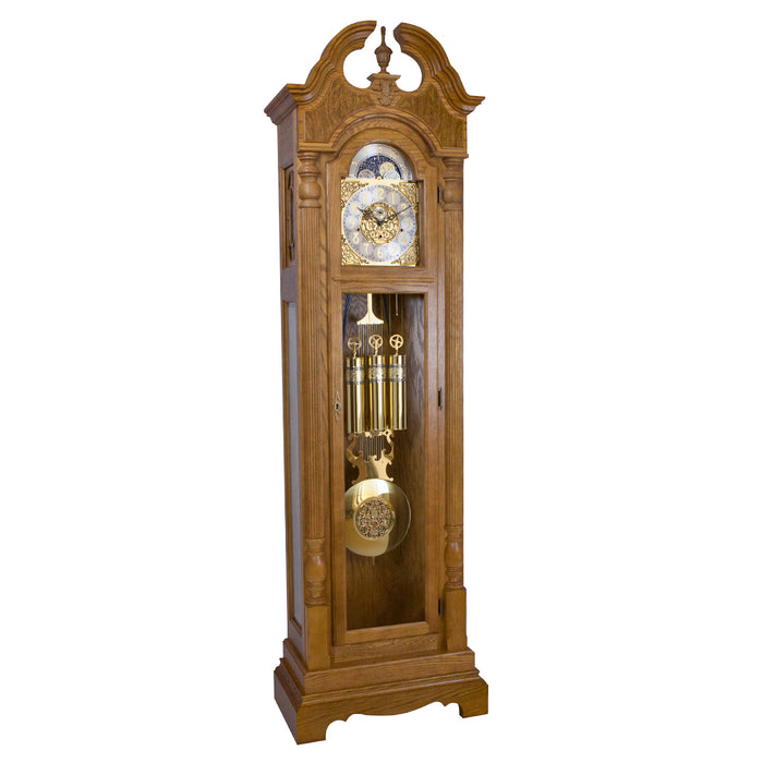 Dark oak wood Grandfather clock with ornate design on white background