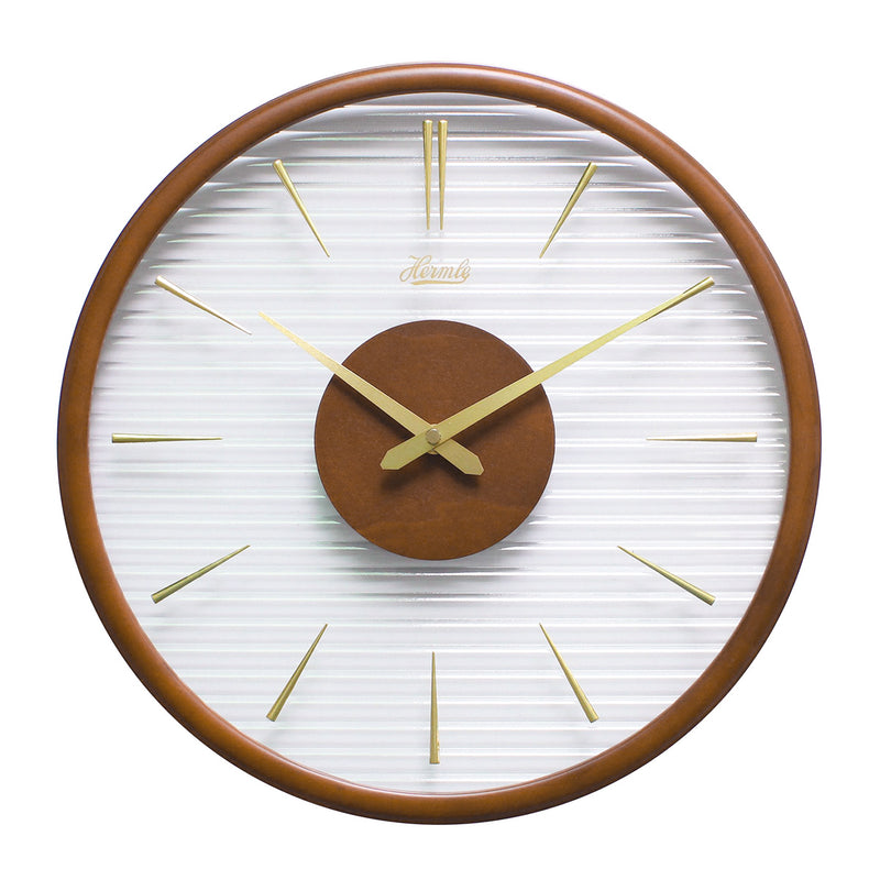 Wooden wall clock with gold numeral markings and hands with clear ridged plastic face on white background.