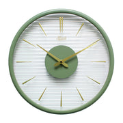 Green wall clock with gold numeral markings and hands with clear ridged plastic face on white background.