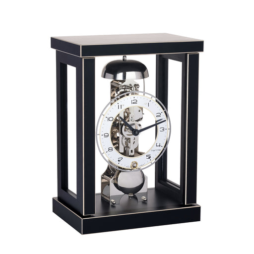Black wood mantel clock with glass sides and visible nickel gears and bell