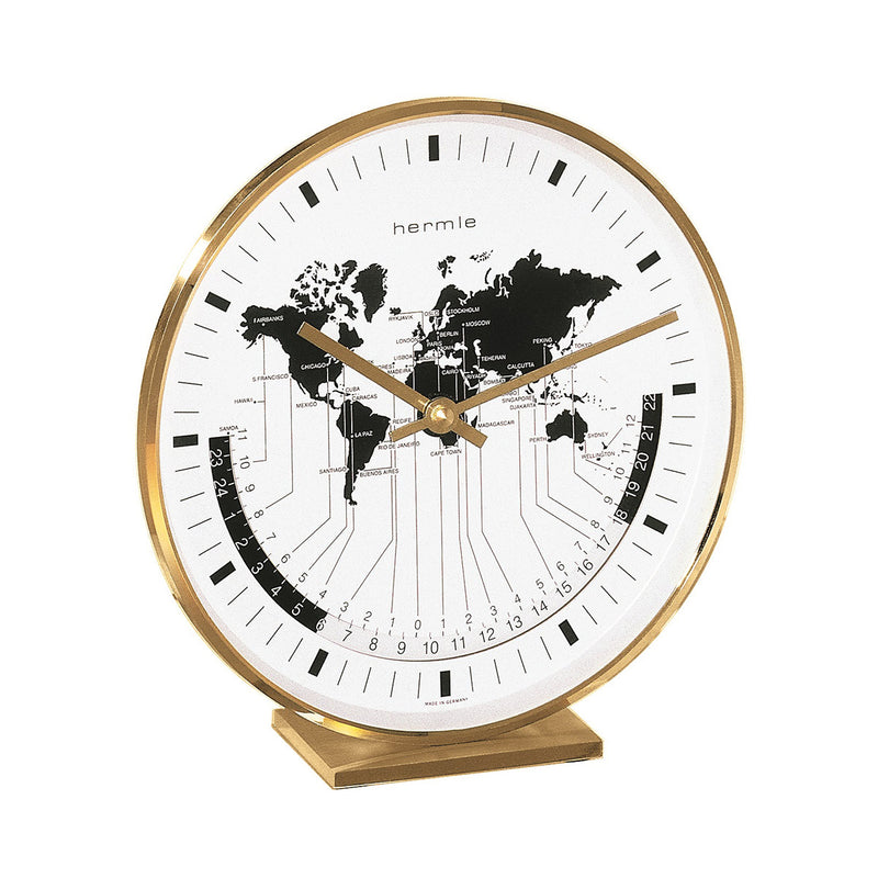 Brass desk clock with brass hands and world map on face.