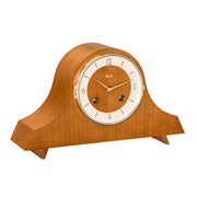 Light Cherry wood mantel clock with holes in the face for winding the mechanical movement inside 