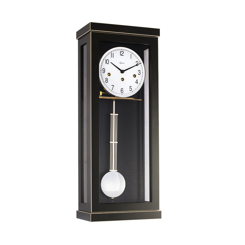 Black wall clock with white face and brass hammers