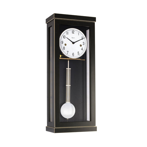Black wall clock with white face and brass hammers