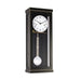 Black wall clock with white face and brass hammers