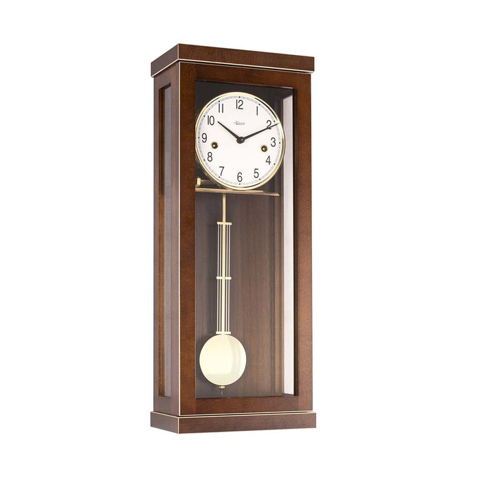 Walnut wood wall clock with pendulum on a white background