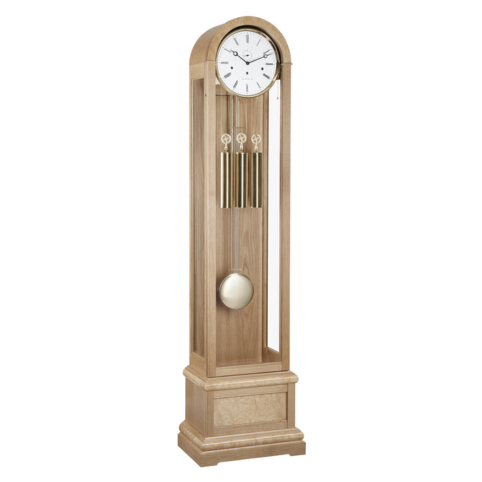 Oak Grandfather clock with brass weights and pendulum on white 