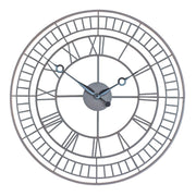 Round metal framework wall clock with roman numerals and black hands on white background.