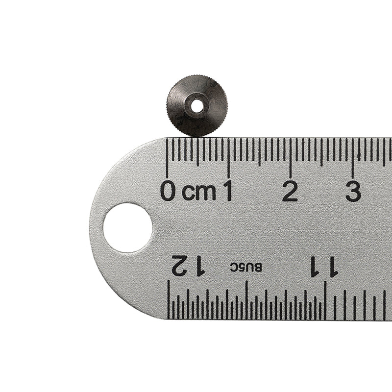 Black metal hand nut next to ruler showing 1 centimeter measurement.
