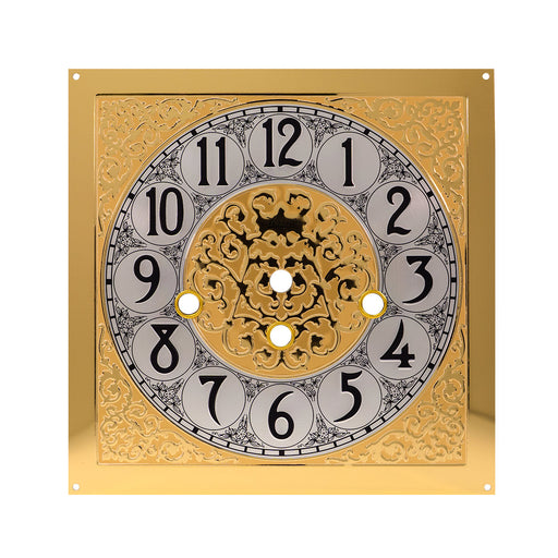 Brass clock face with ornate design on white background.