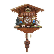 Ornate wooden cuckoo clock with flower detail and squirrel figurine on white background.