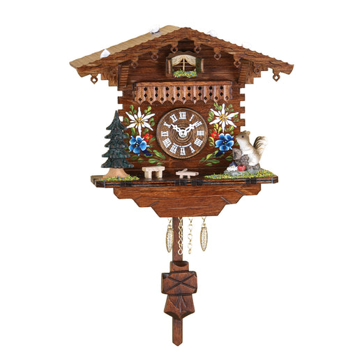 Ornate wooden cuckoo clock with flower detail and squirrel figurine on white background.