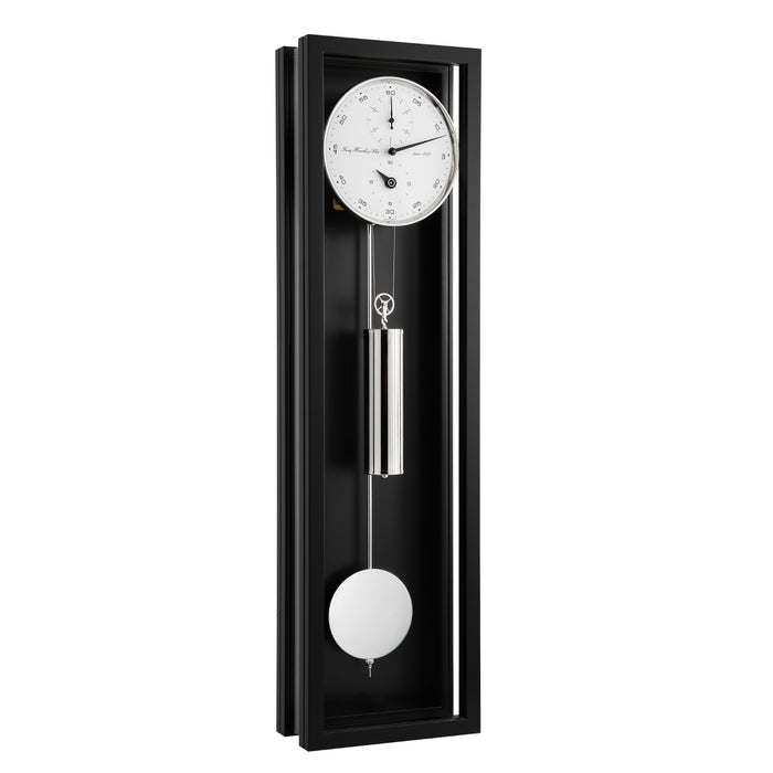 Black wall clock with silver pendulum and weights and white face