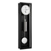 Black wall clock with silver pendulum and weights and white face