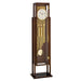 Tubular floor clock with brass highlights and white face on white background