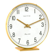 Brass desk clock with bold numbers and Hermle logo on white background.