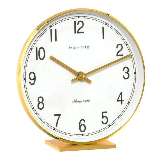 Brass desk clock with bold numbers and Hermle logo on white background.