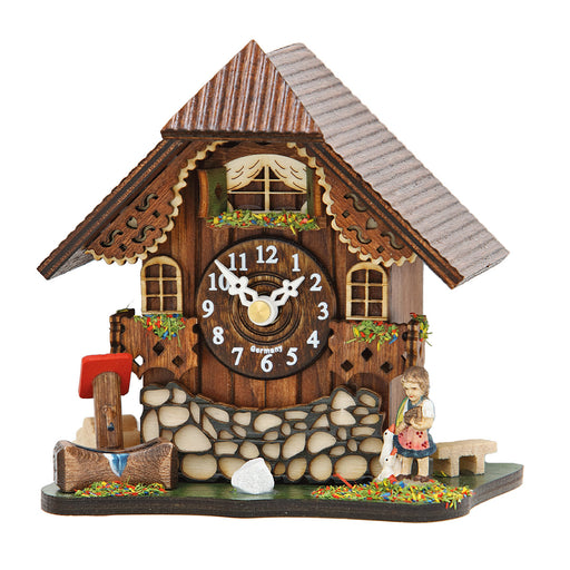 Small wooden cuckoo clock with girl figurine and water trough on white background.