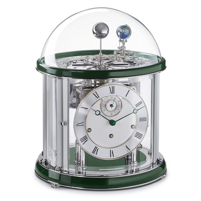 Green and silver Tellurium clock with glass dome and nickel plated mechanical gears visible on white background.