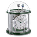 Green and silver Tellurium clock with glass dome and nickel plated mechanical gears visible on white background.