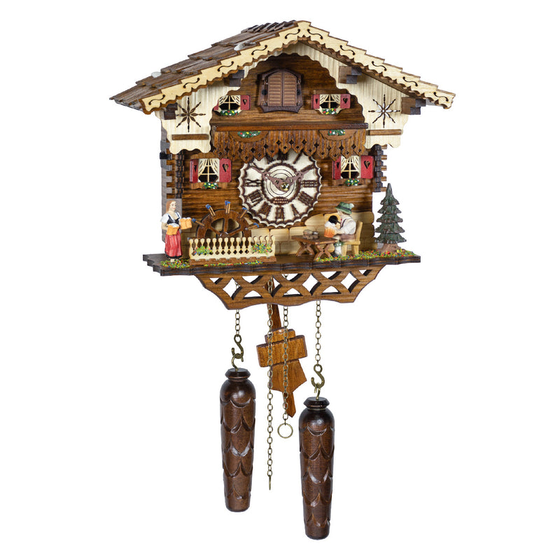 Intricately detailed German cuckoo clock with house style, small figurines and roman numeral face