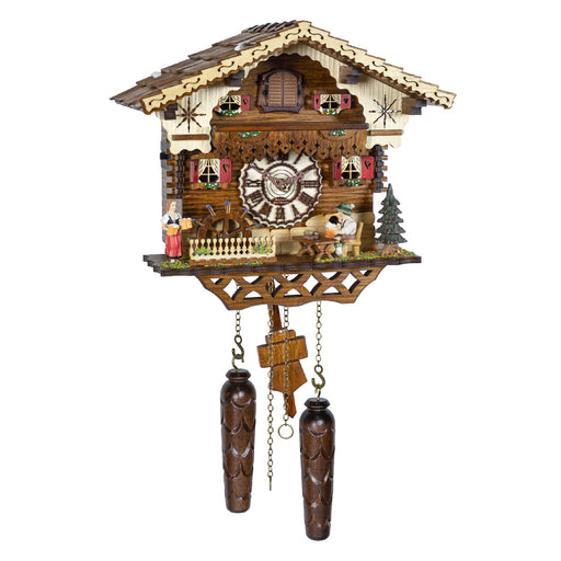 Intricately detailed German cuckoo clock with house style, small figurines and roman numeral face