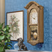 Wooden vintage style wall clock in farmhouse living room. 
