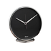 Round black and metallic desk clock in minimalist style, on white background.