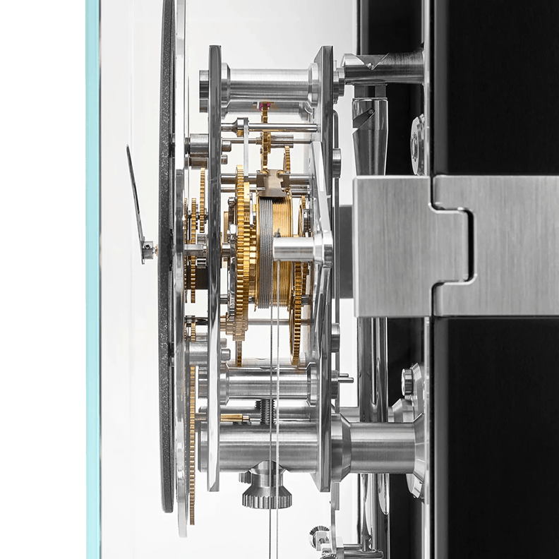 Close-up of a complex mechanical clock with visible gears and components.