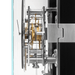 Close-up of a complex mechanical clock with visible gears and components.